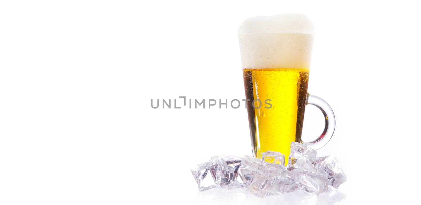 fresh cold beer with ice and foam and water drops