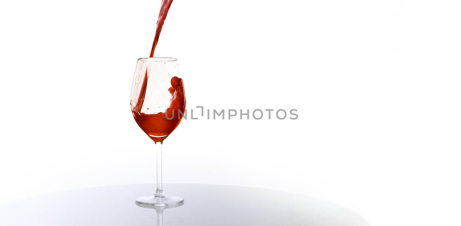 Pour yourself a glass of wine on white background