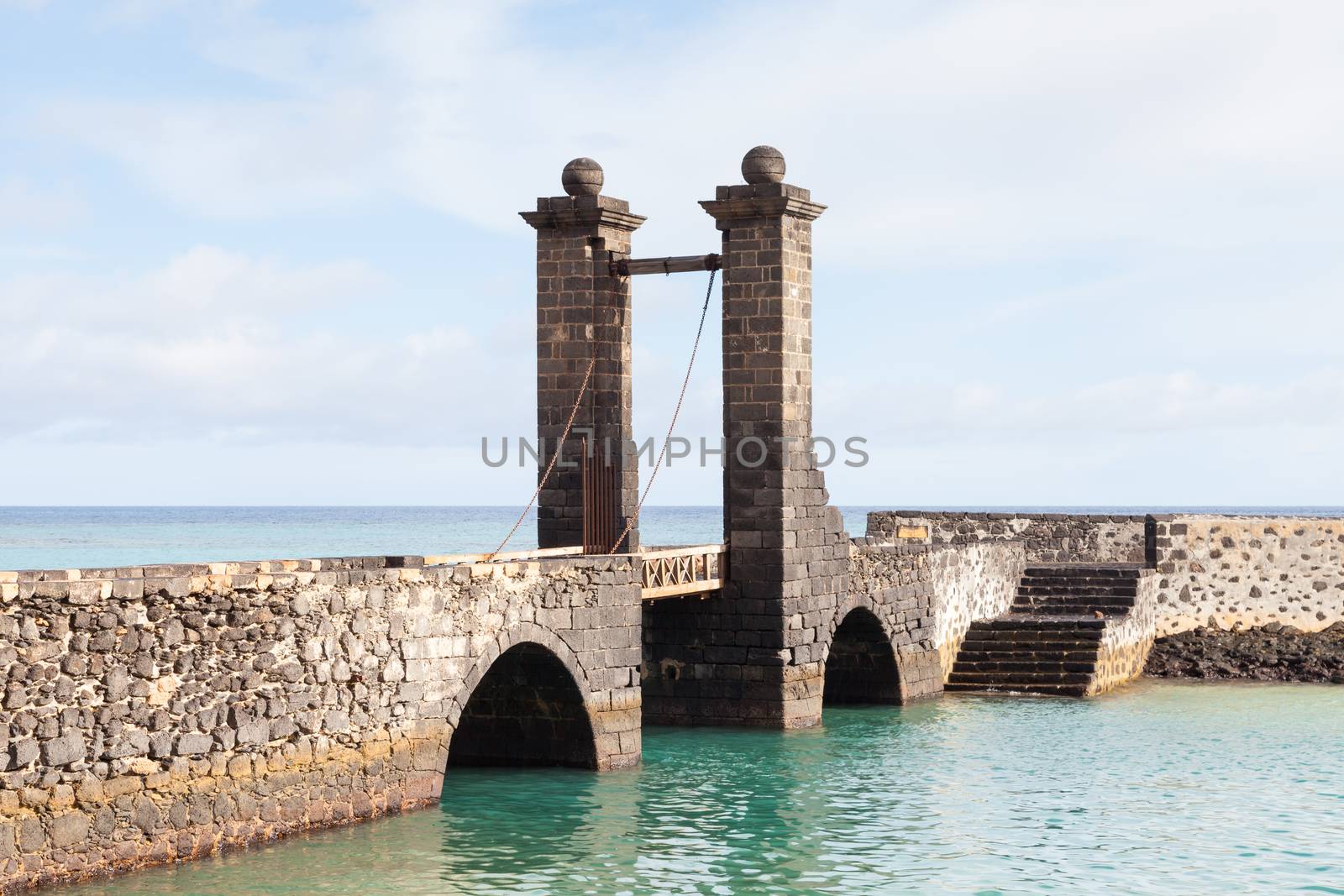 Puente de las Bolas leads to San Gabriel Castle in the port city of Arrecife on the Spanish island of Lanzarote.