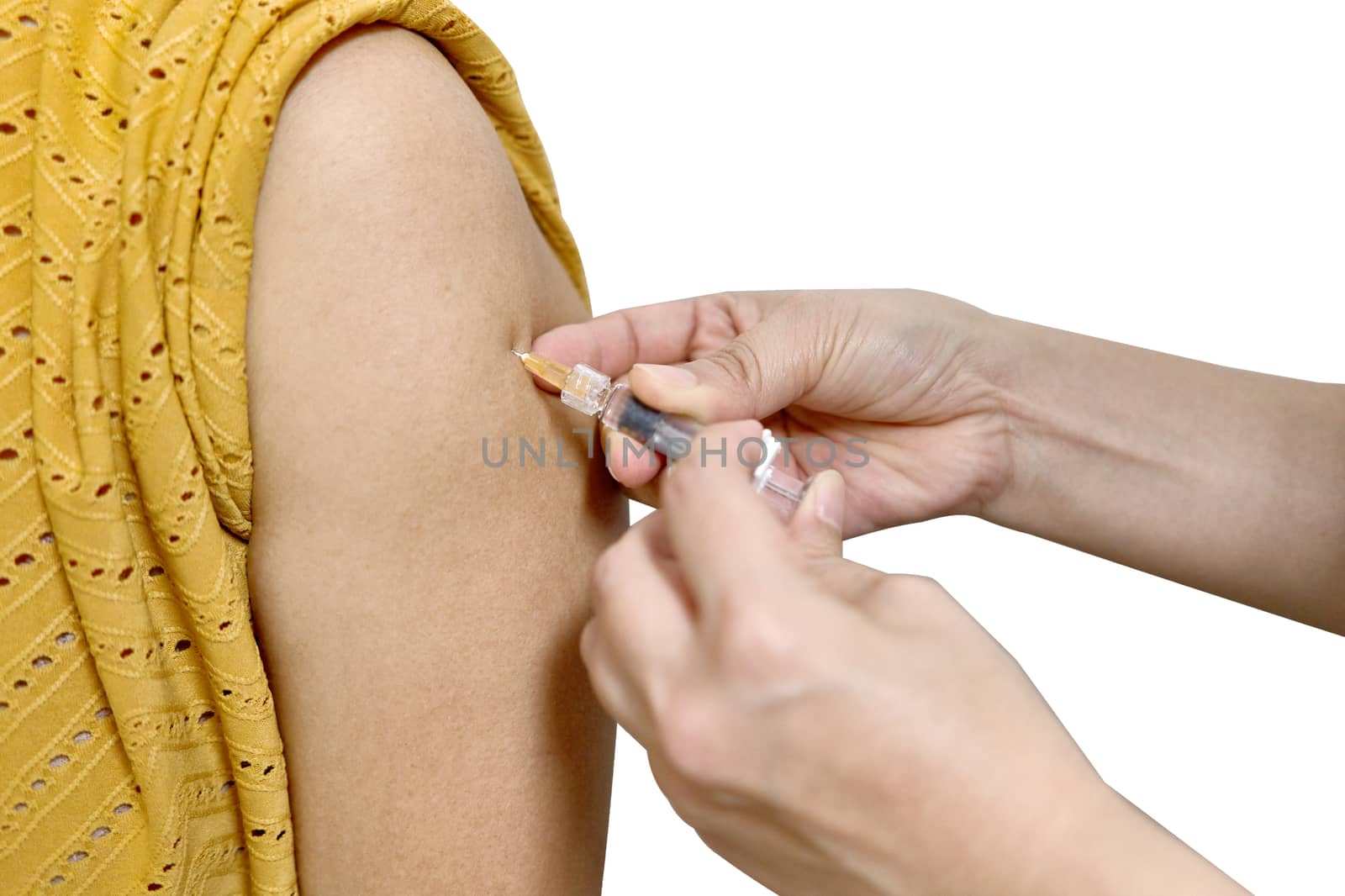 Hand of nurse push hypodermic syringe injected vaccine of flu with left shoulder of woman in brown blouse isolated on white background. Healthcare and medical concept photography.