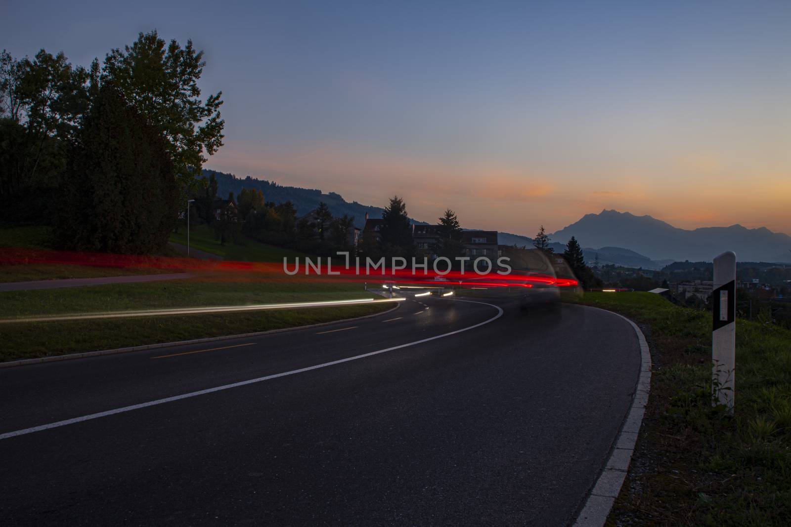 head and back lights with long exposure causing long light streak by PeterHofstetter