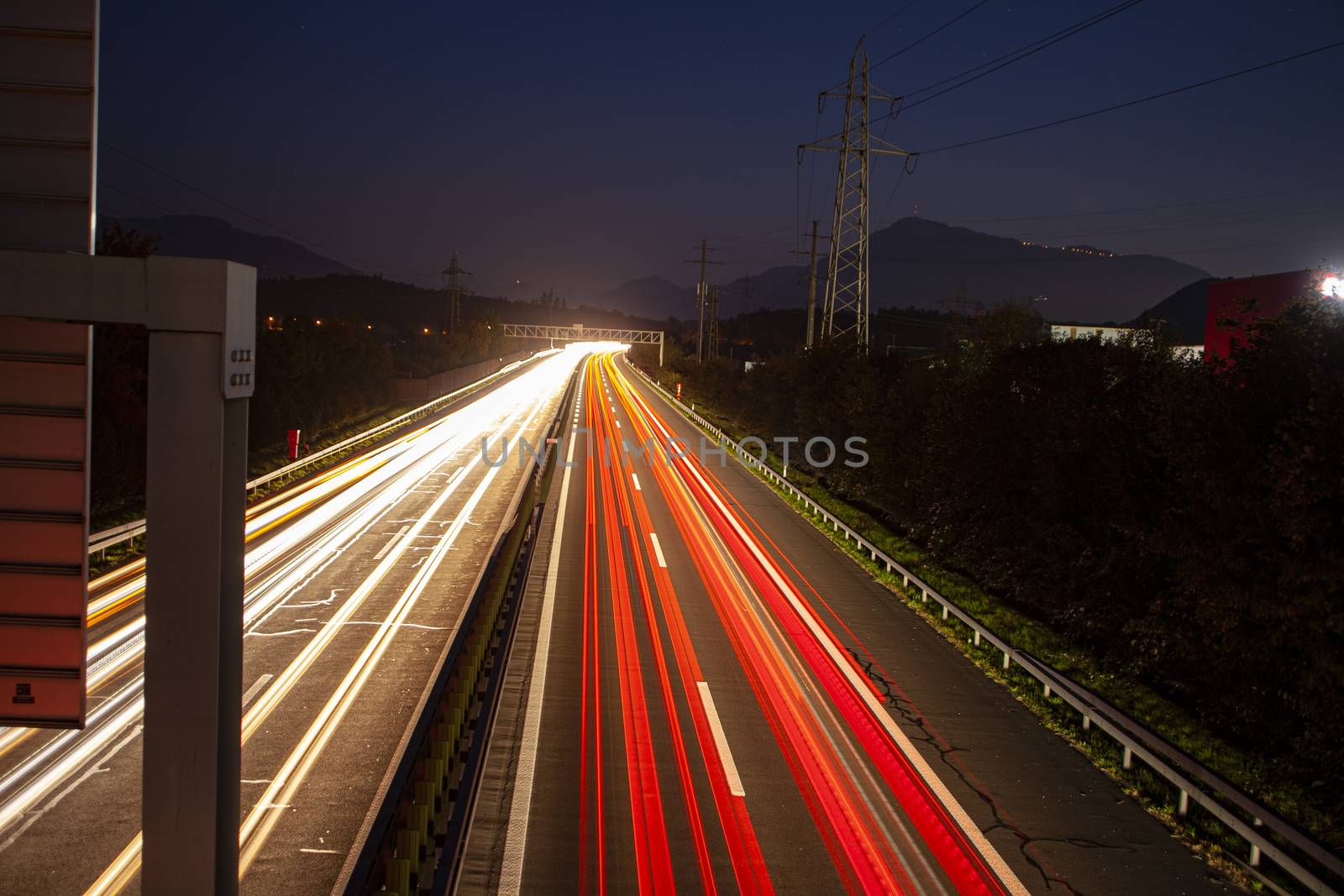 head and back lights with long exposure causing long light streaks. Long exposure