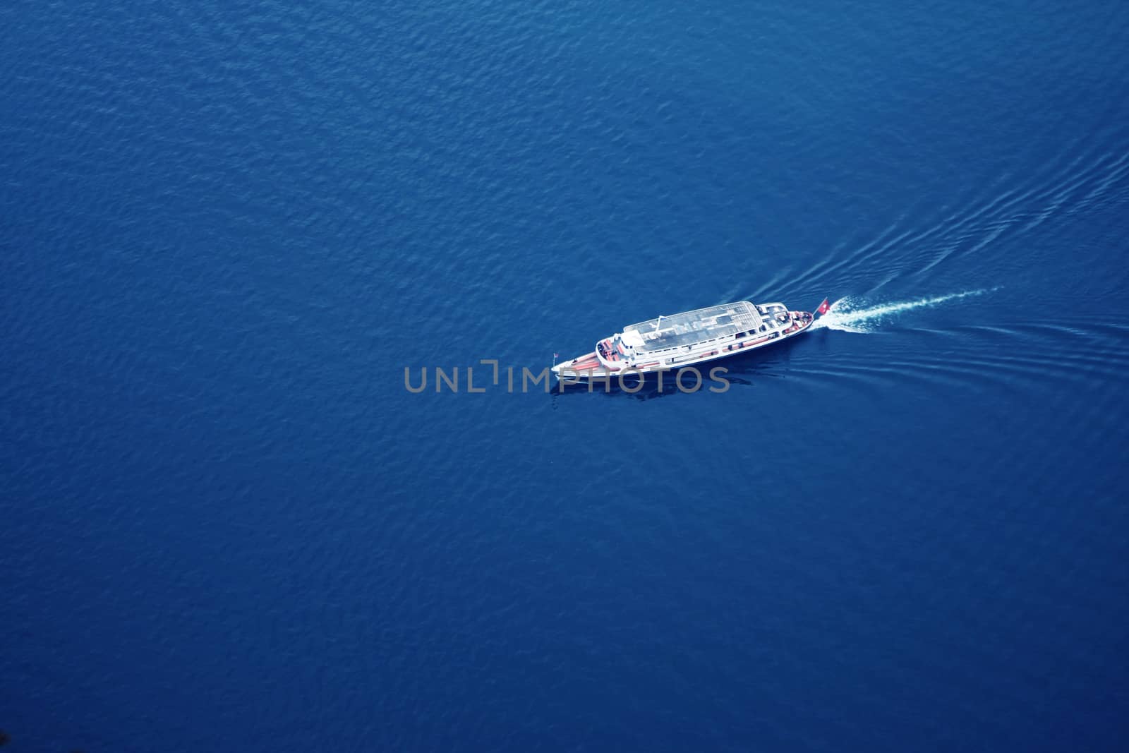 boat on lake shot from above. by PeterHofstetter