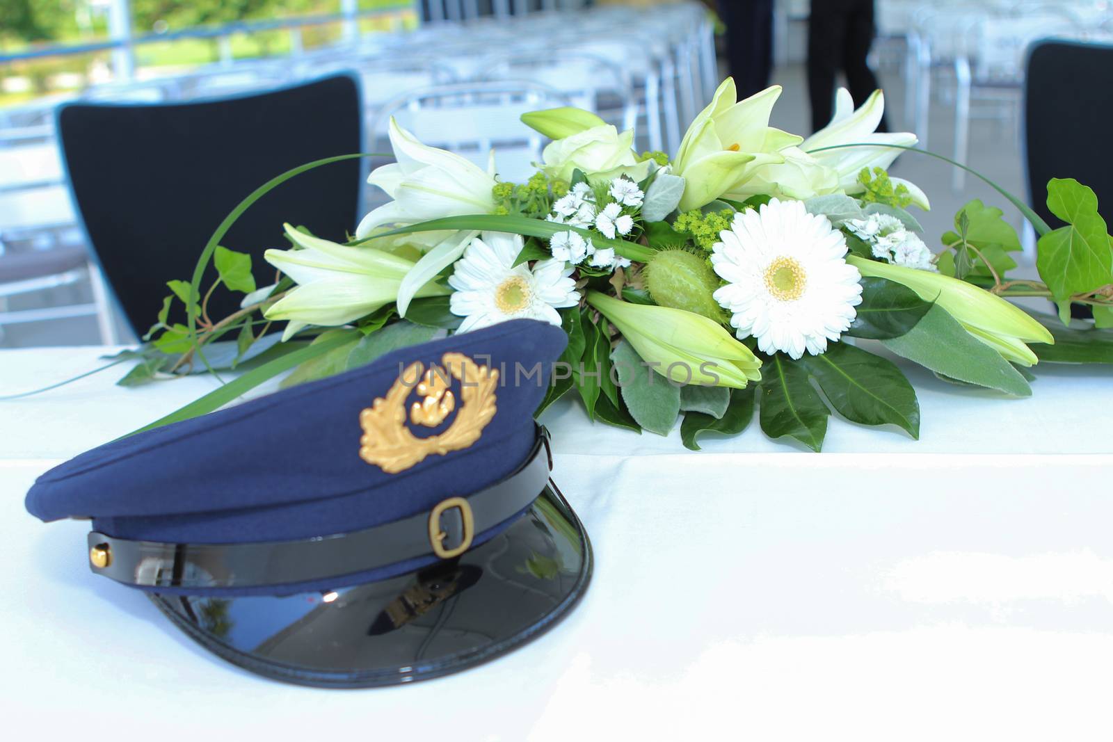 wedding flowers on a boat with the hat of the captain