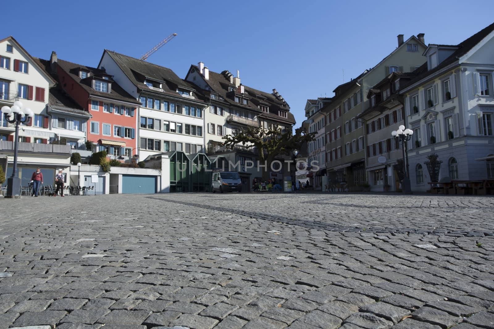 peaceful day on the pier on lake zug, switzerland. Downtown Zug