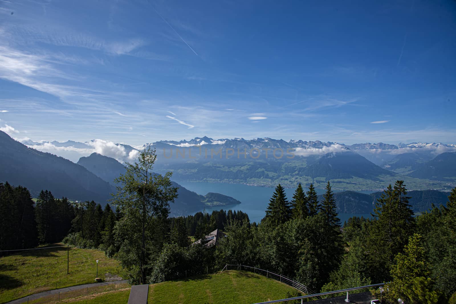 Swiss Alps landscape up in rigi Kaltbad with trees, mountains and blue sky