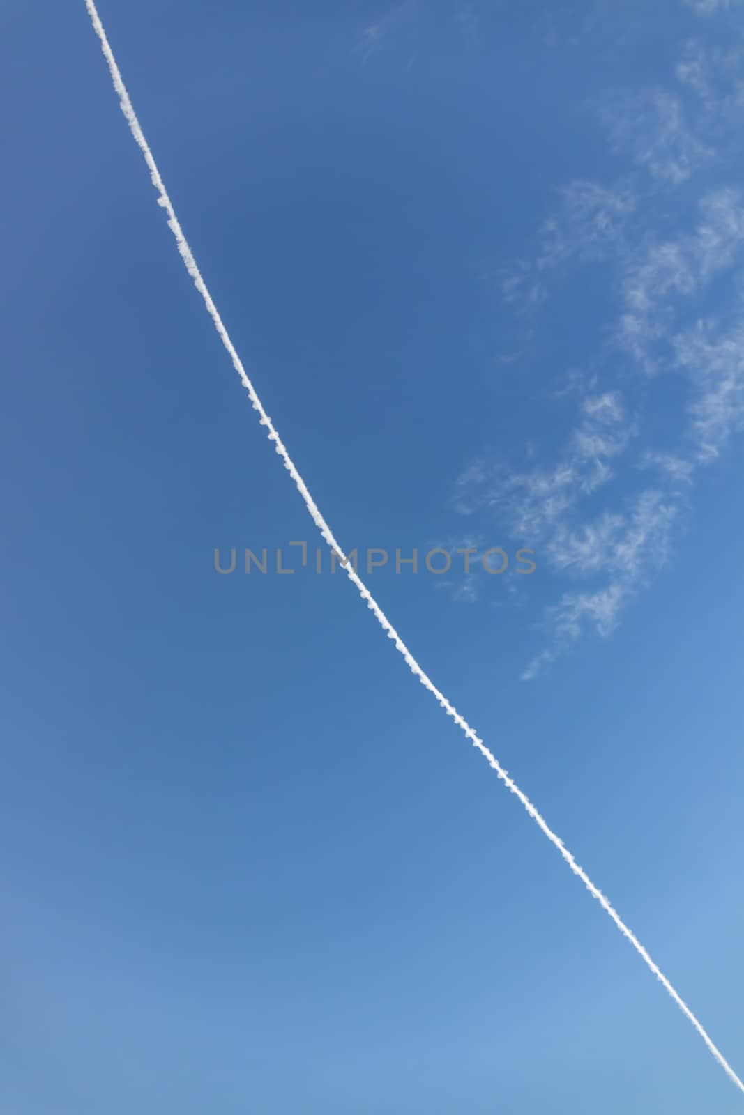 jet fuel trail left by planes at the sky