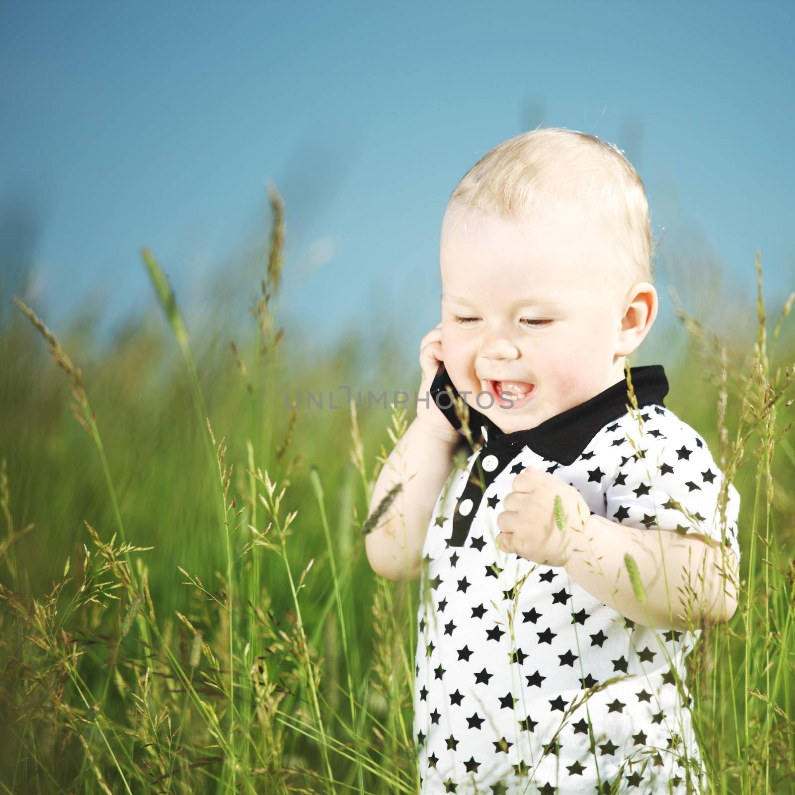 Boy in grass call by phone by Yellowj