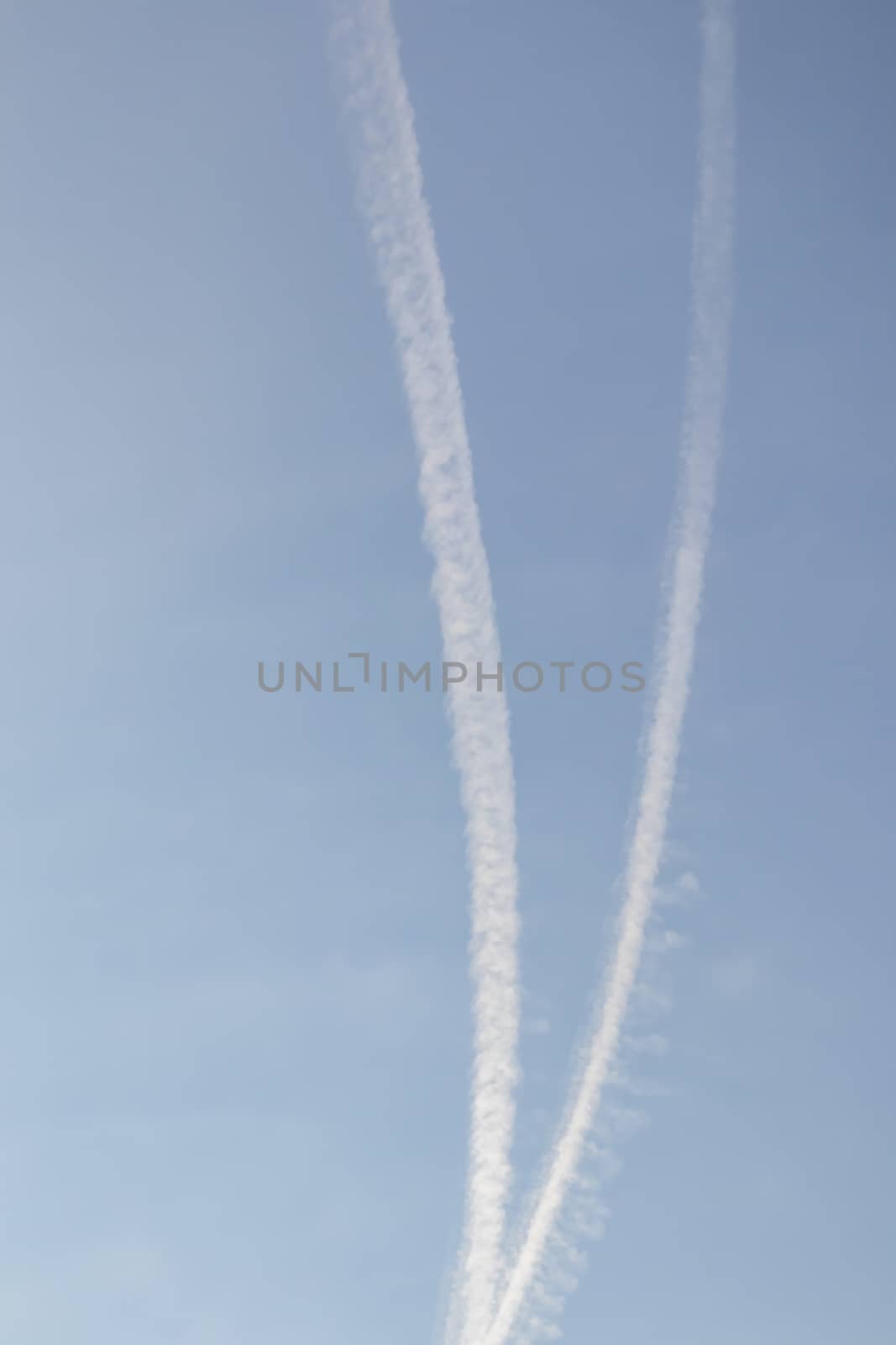 jet fuel trail left by planes at the sky by yilmazsavaskandag