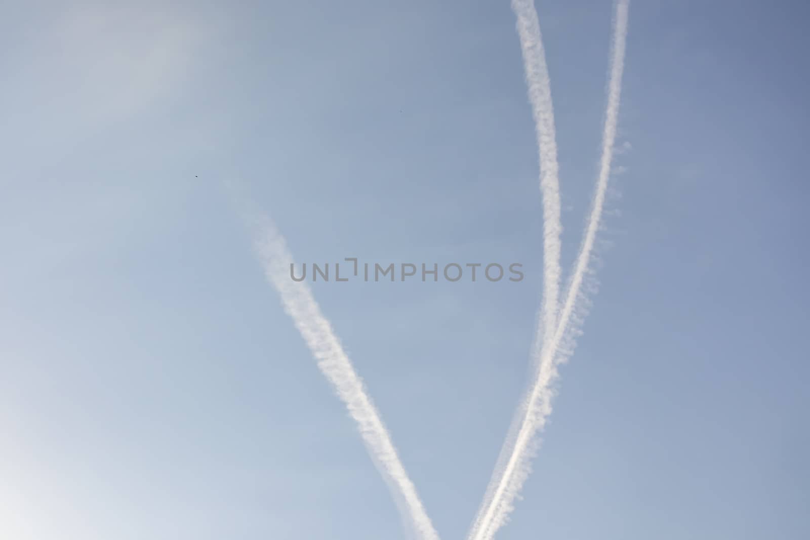 jet fuel trail left by planes at the sky by yilmazsavaskandag