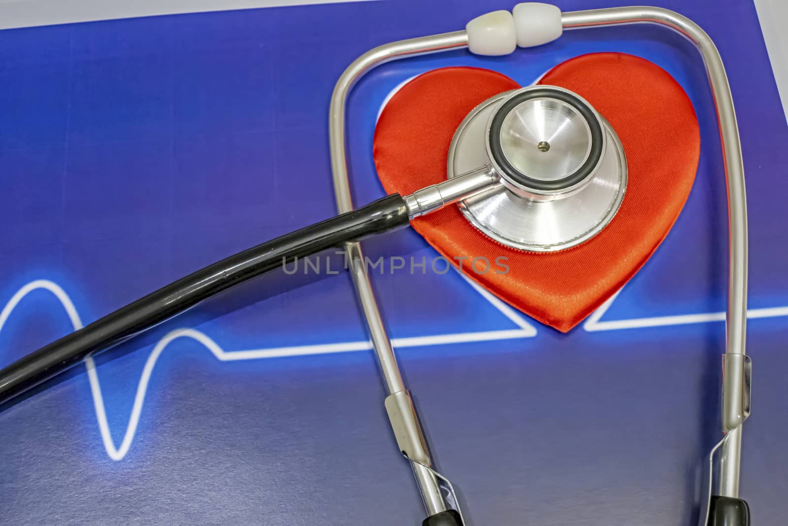 close up heart health and stethoscope on background