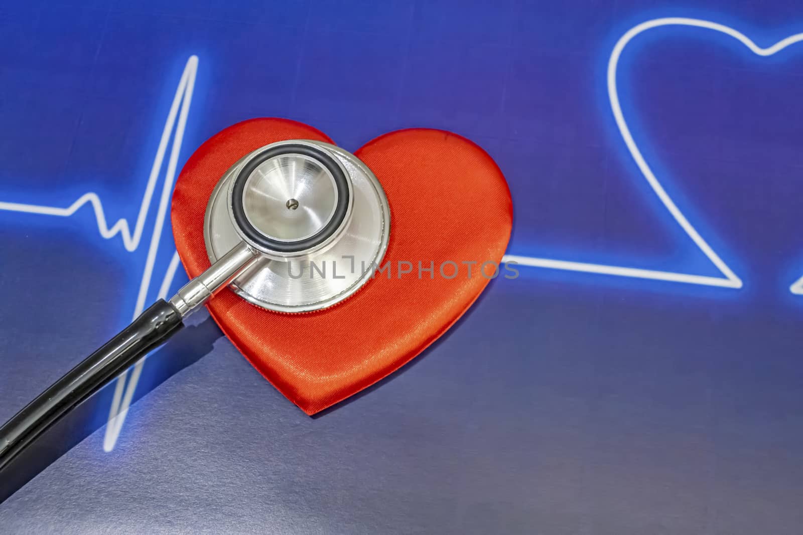 close up heart health and stethoscope on background