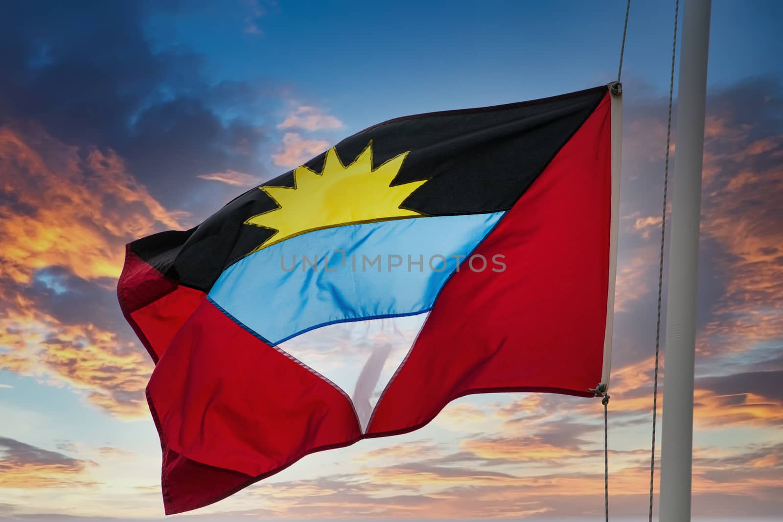 Flag of Antigua on Sunset Sky by dbvirago