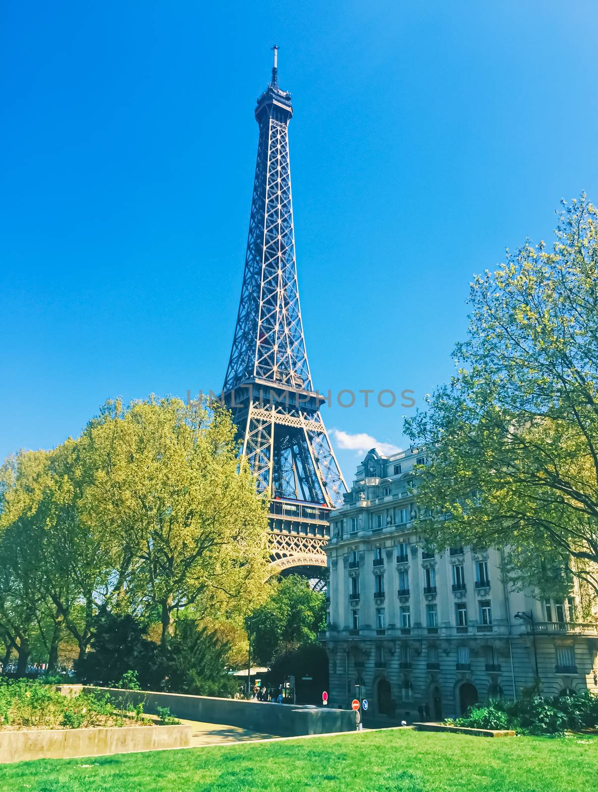 Eiffel Tower and blue sky, famous landmark in Paris, France by Anneleven