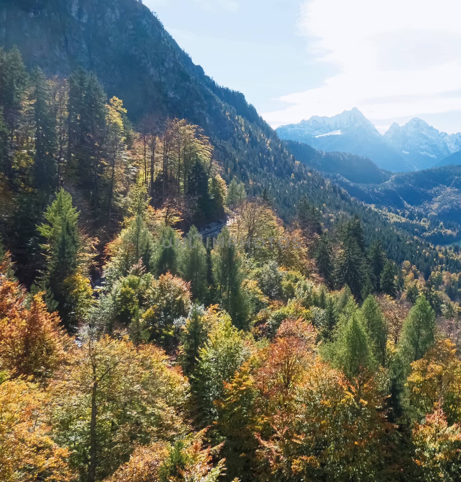 Beautiful nature of European Alps, landscape view of alpine mountains, lake and village on a sunny day, travel and destination scenery