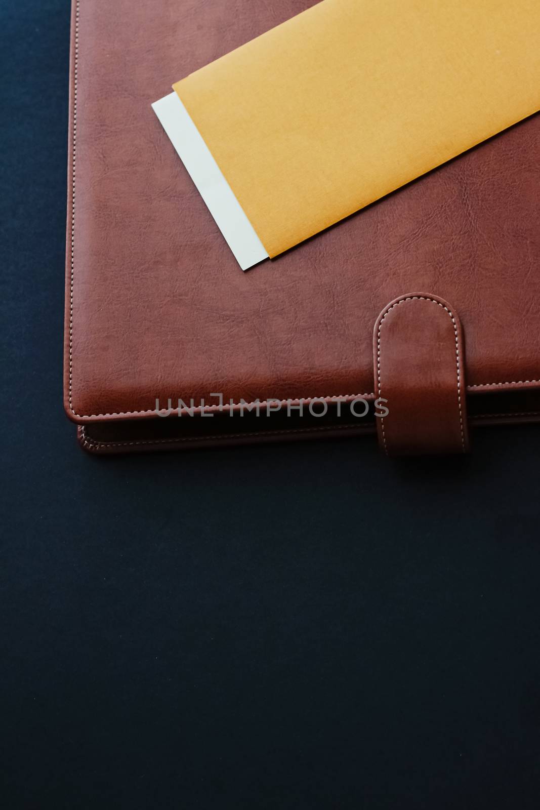 Office desk with briefcase and business card, finance and econom by Anneleven