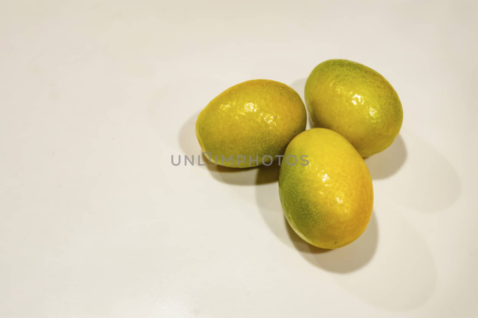 close up kumquat fruits on background