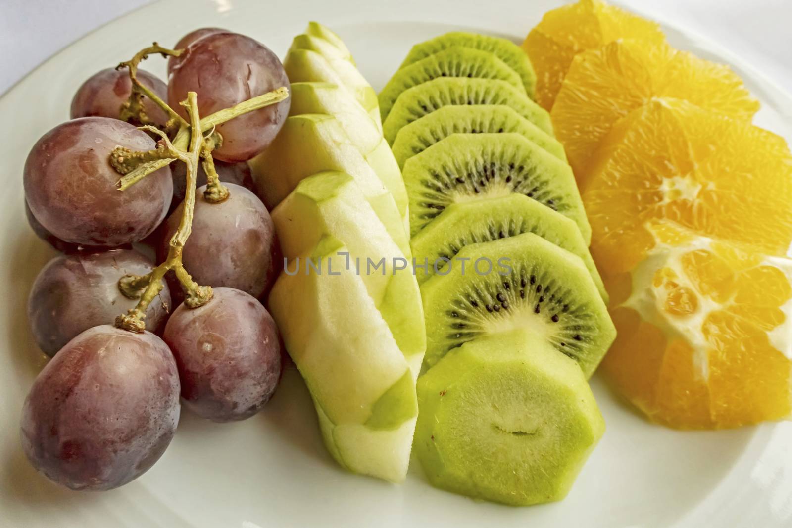 ready to eat sliced mixed fruits in plate by yilmazsavaskandag