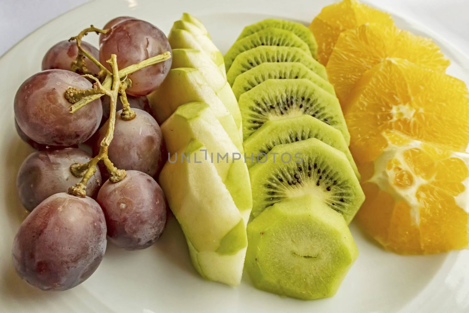 ready to eat sliced mixed fruits in plate