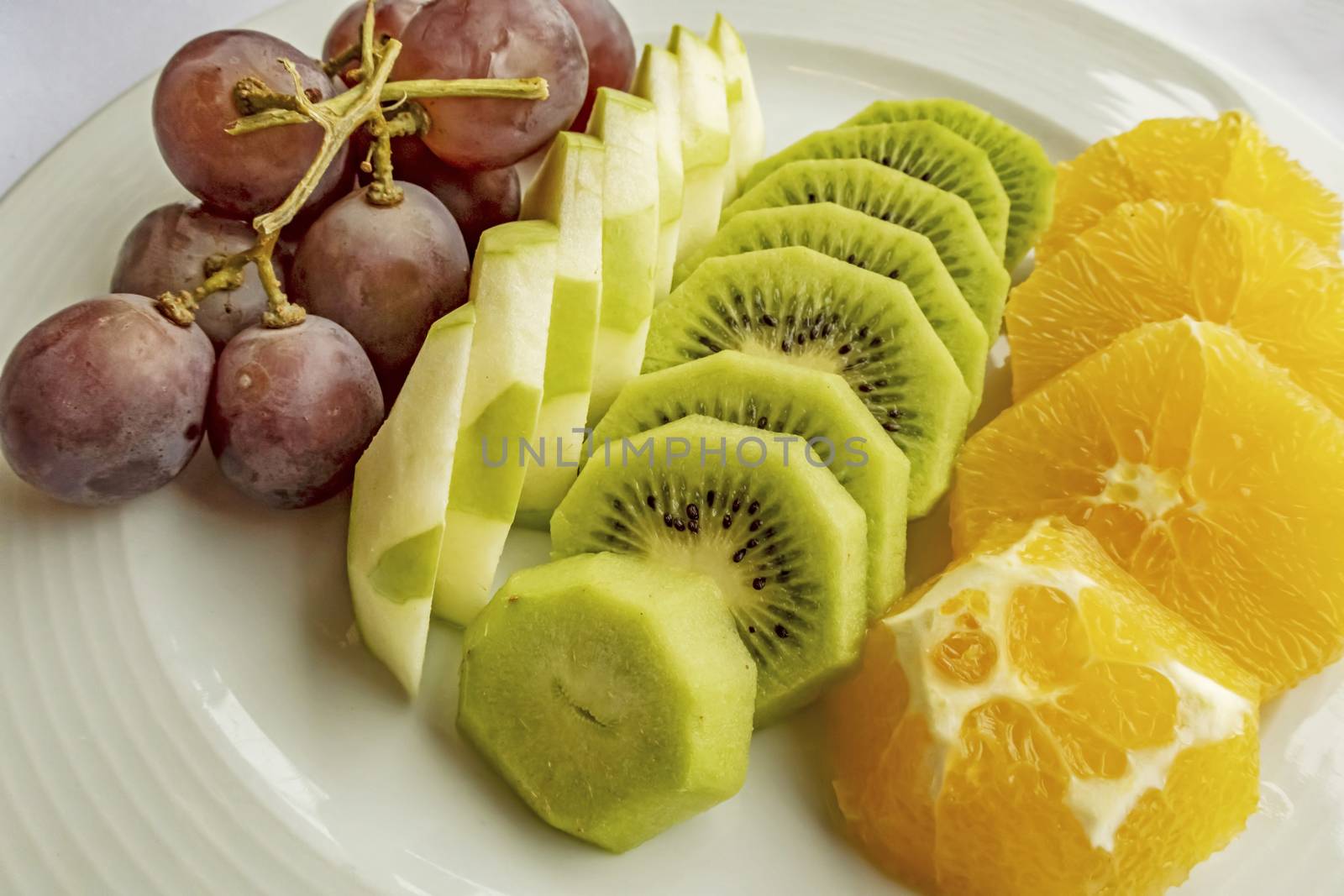 ready to eat sliced mixed fruits in plate by yilmazsavaskandag