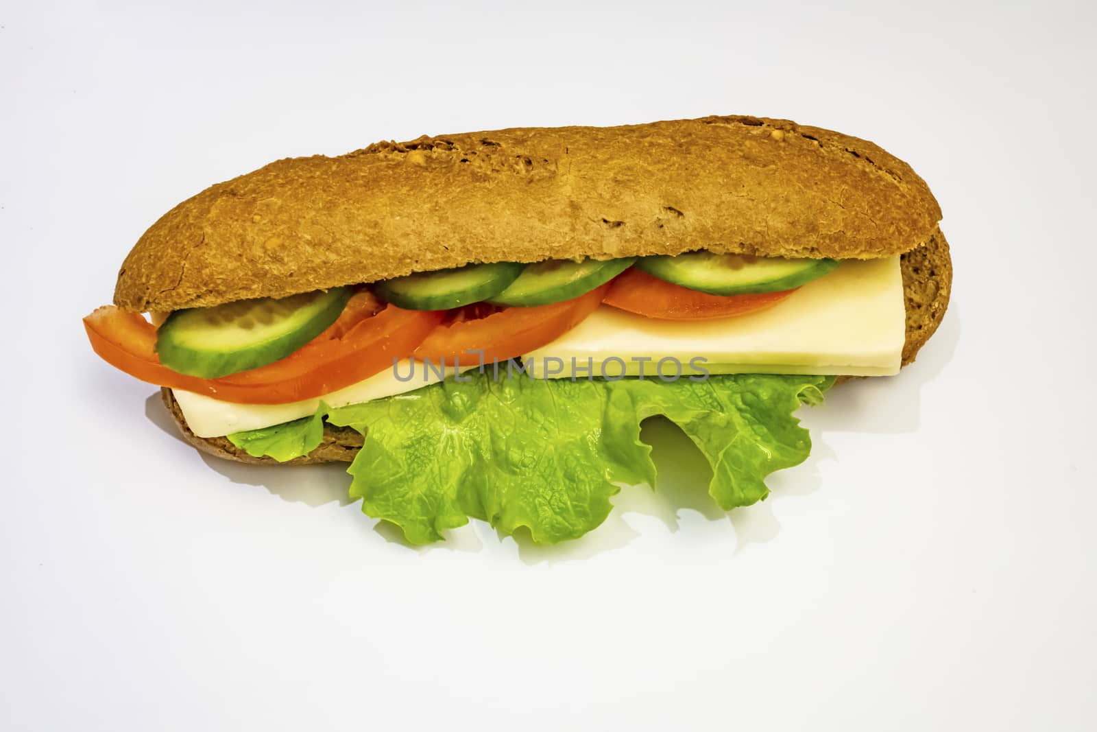 ready to eat sandwich with lettuce,cheese, sliced tomatoes and cucumber