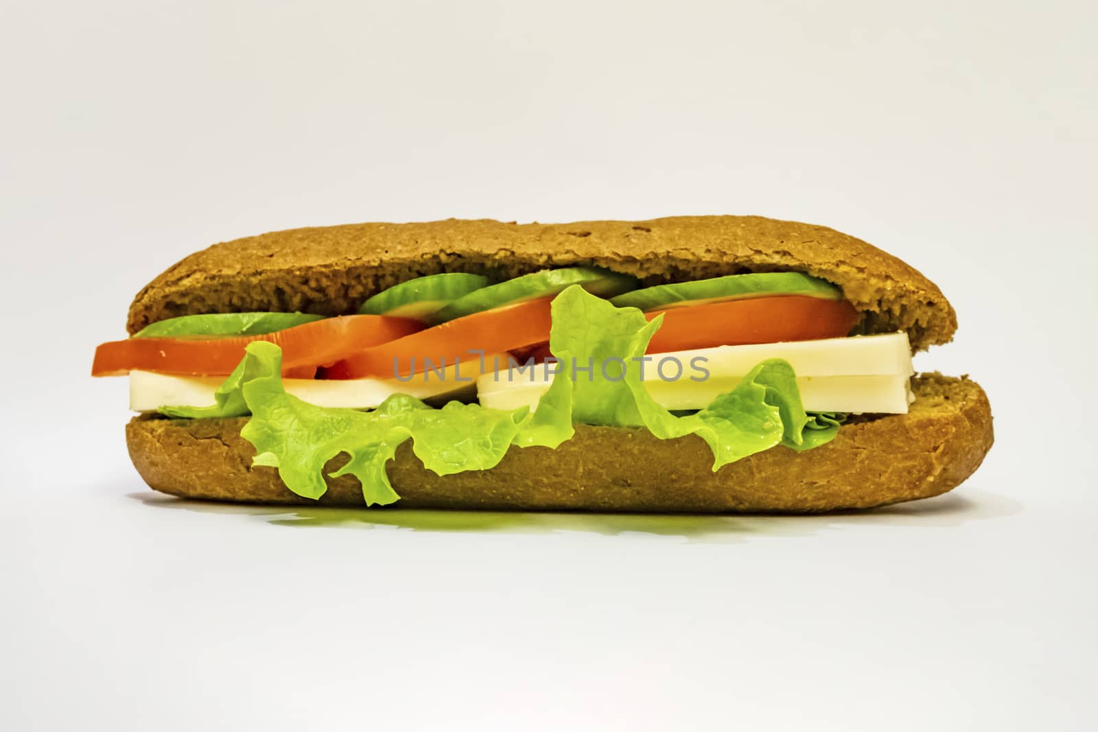 ready to eat sandwich with lettuce,cheese, sliced tomatoes and cucumber