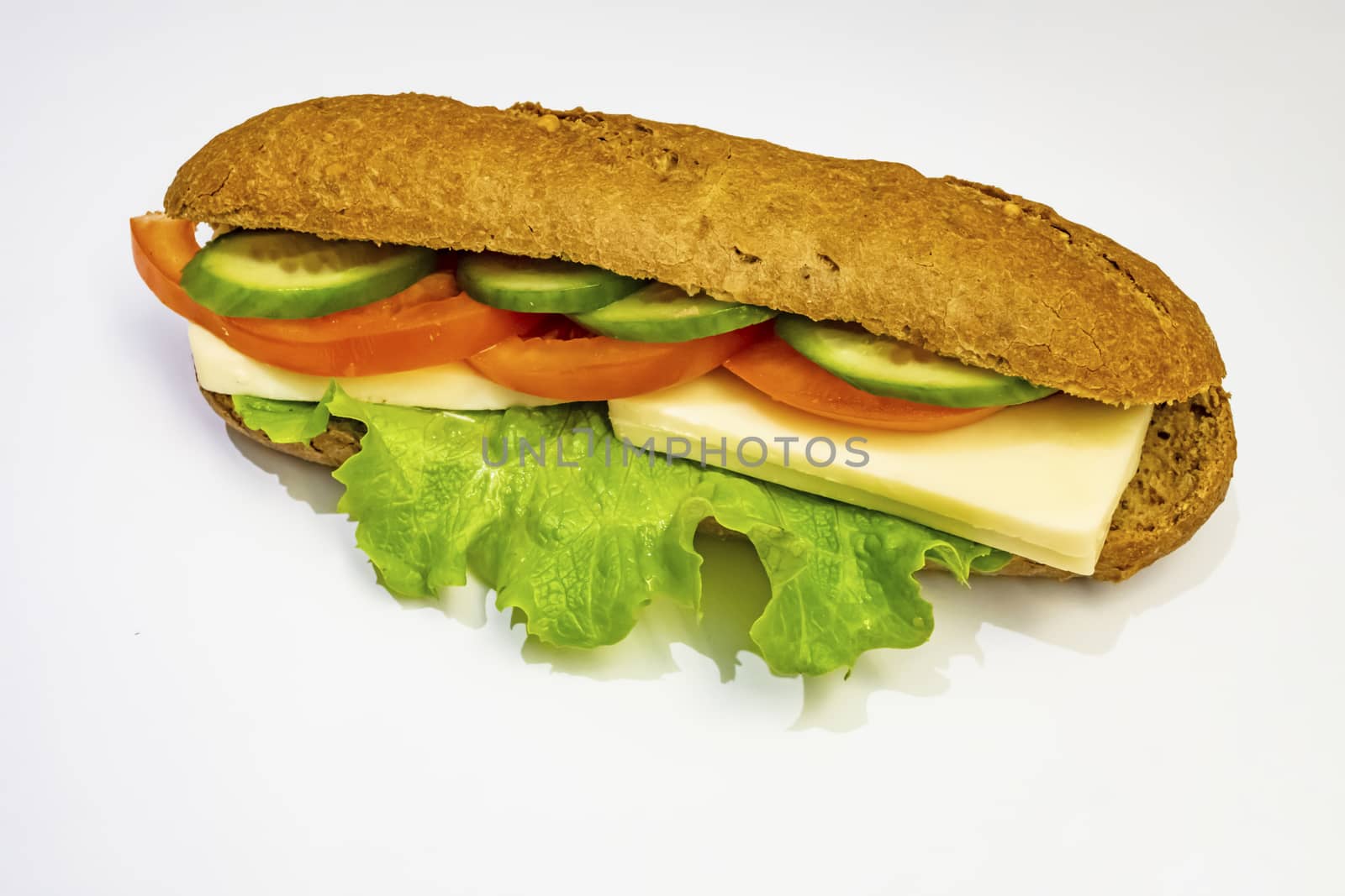 ready to eat sandwich with lettuce,cheese, sliced tomatoes and cucumber