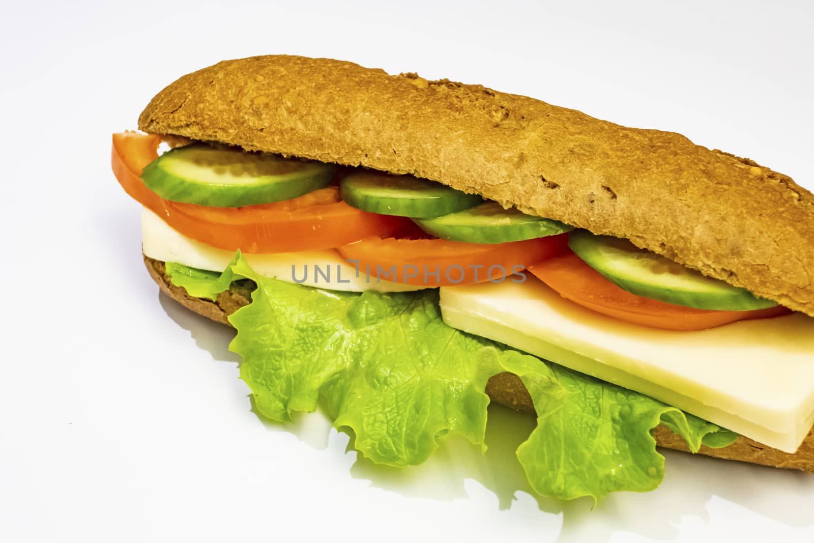 ready to eat sandwich with lettuce,cheese, sliced tomatoes and cucumber