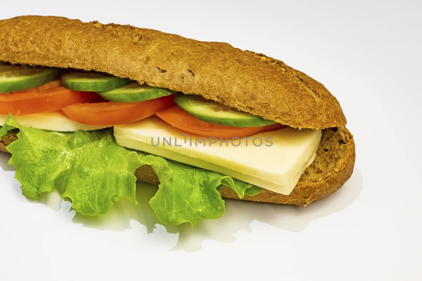ready to eat sandwich with lettuce,cheese, sliced tomatoes and cucumber