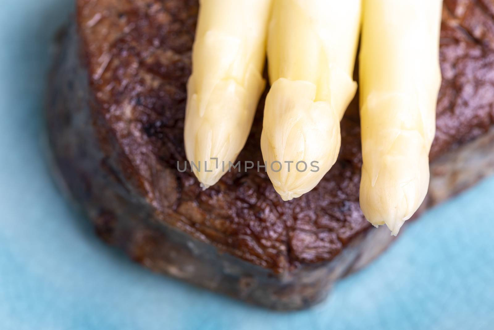 asparagus with potatoes and a steak