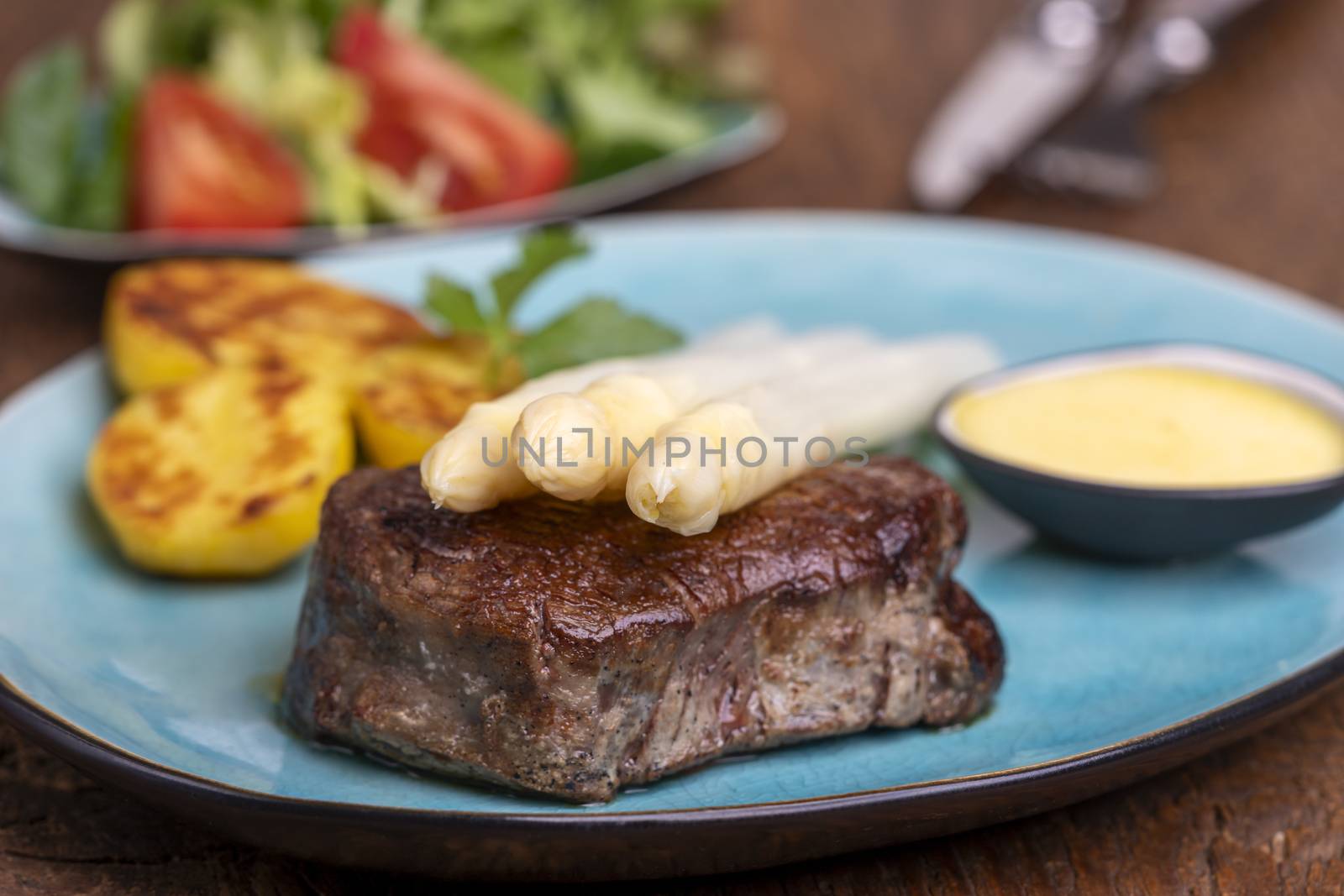 asparagus with potatoes and a steak