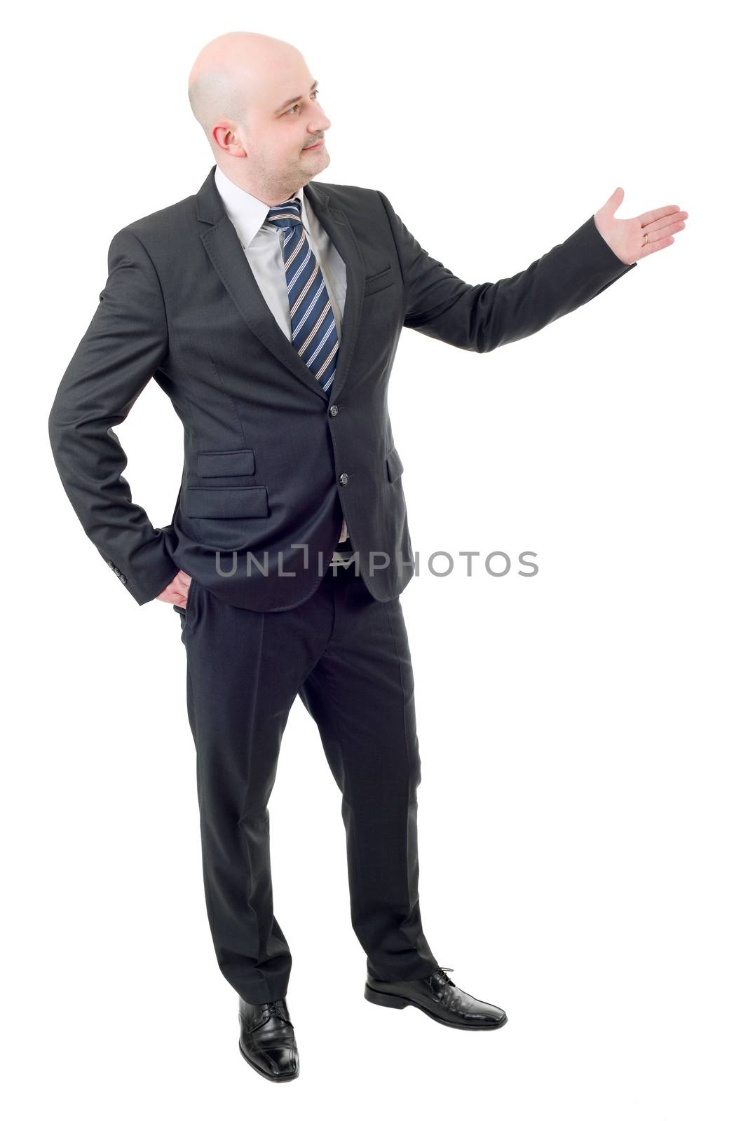 Handsome businessman with arm out in a welcoming gesture, isolated on white