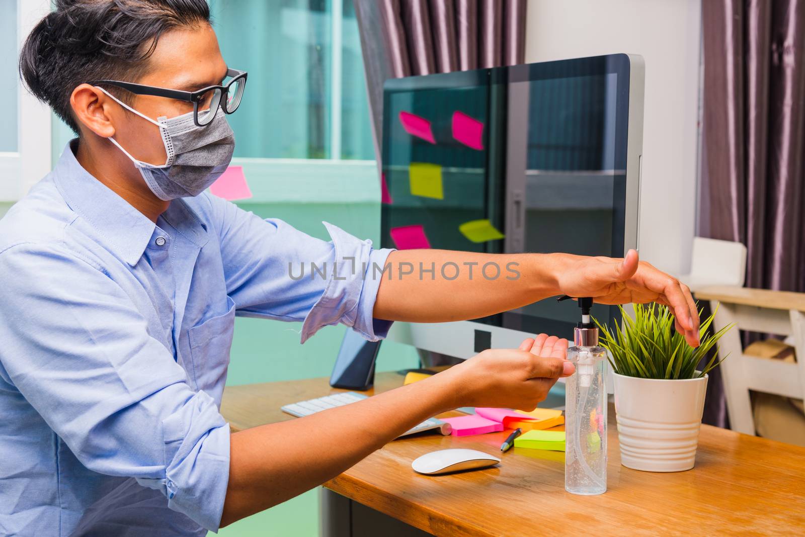 Business young man working from home office he quarantines disea by Sorapop
