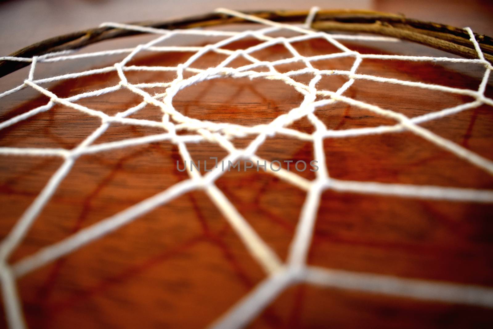A home made dream catcher, woven with vine.