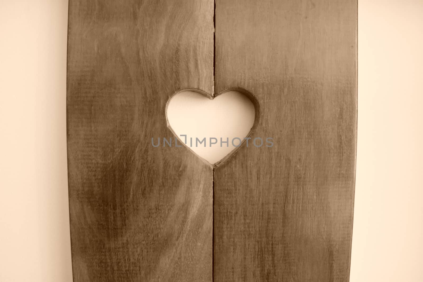 Heart shape carved in wood.