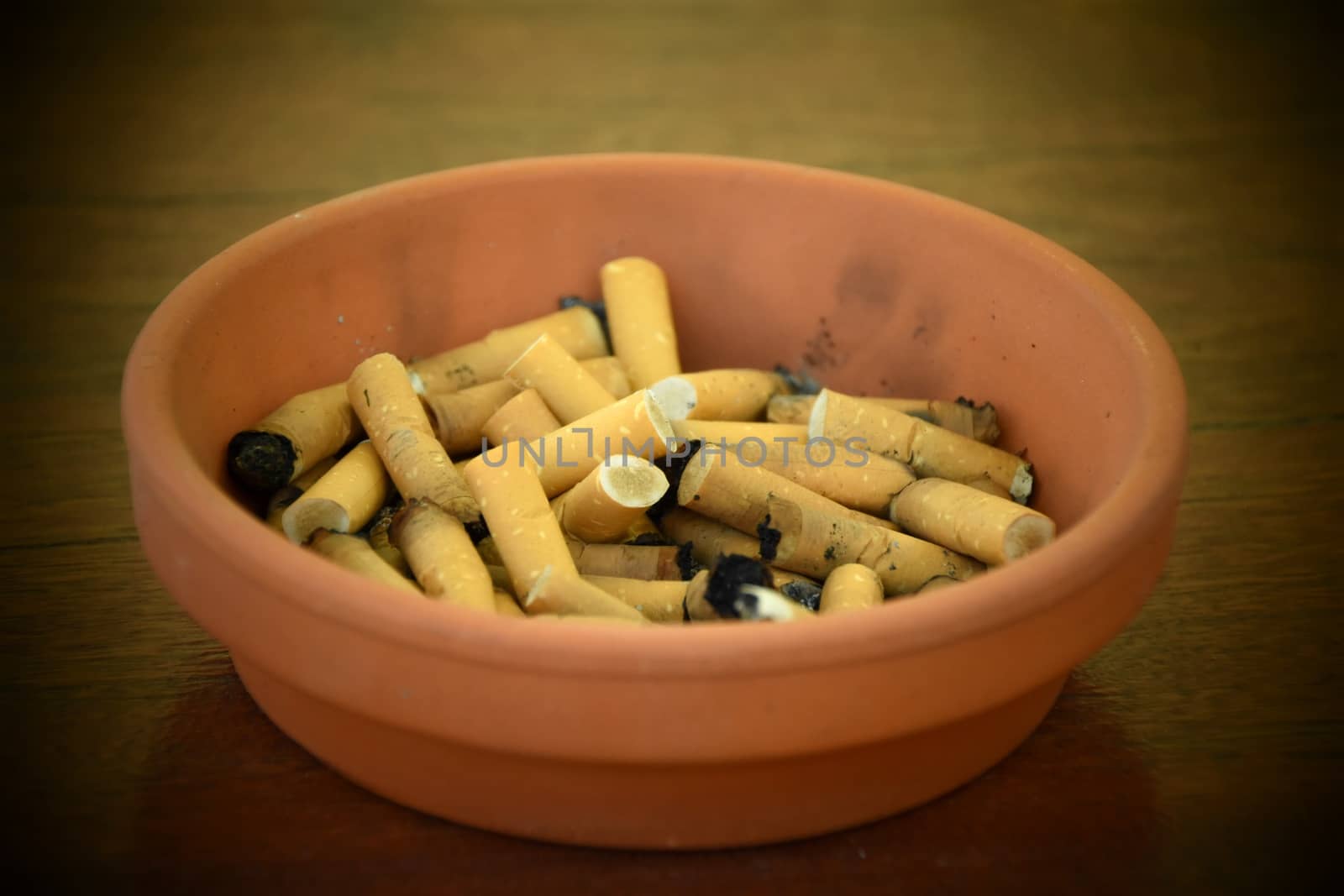 An ash tray full of cigarettes