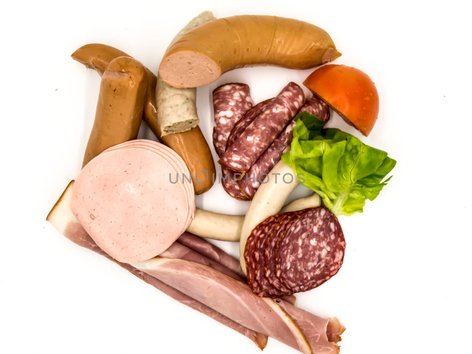 Different kinds of sausage and smoked bacon, top view on a white background
