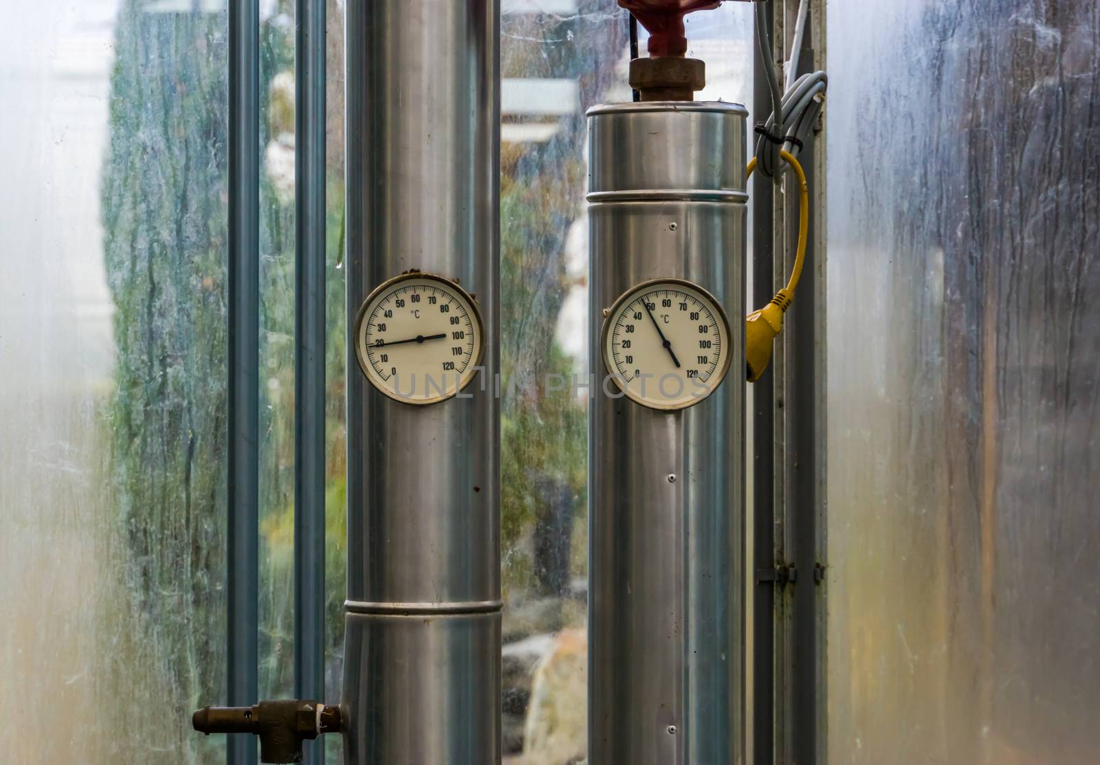 two pipes with pressure heat meters, modern industrial equipment