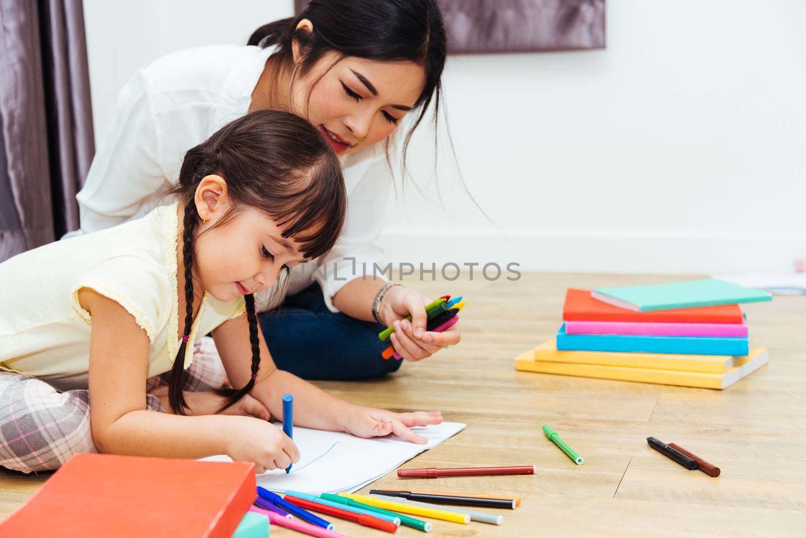 Child kid girl kindergarten drawing teacher education mother with beautiful mother at interior room home
