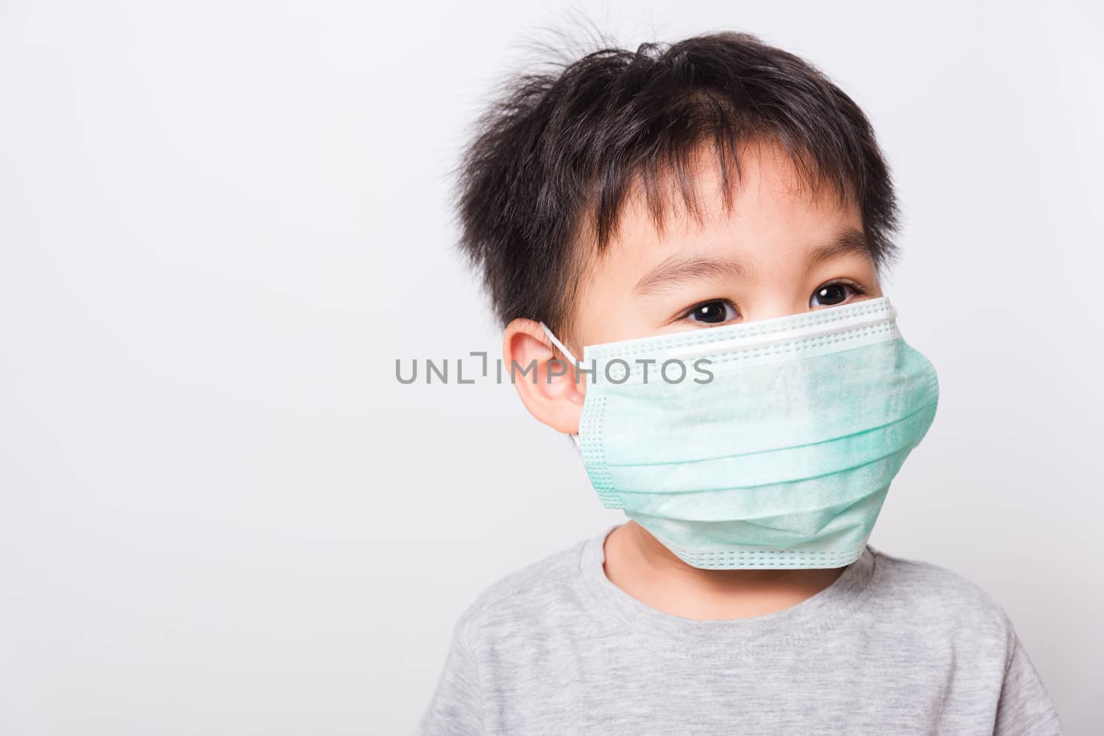 Closeup Asian face, Little children boy sick he using medicine healthcare mask on white background with copy space, health medical care