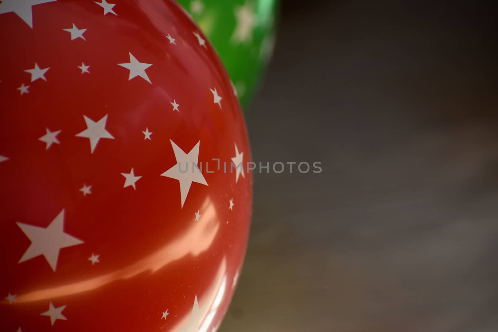 Vibrant Colorful balloons on a wooden background with copy space by benentaylor