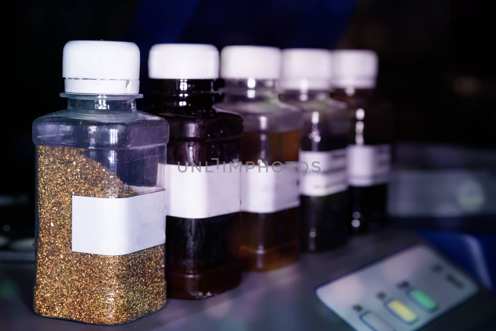 Close-up of a row of glass vials with samples for scientific experiments. The concept of scientific research and development.