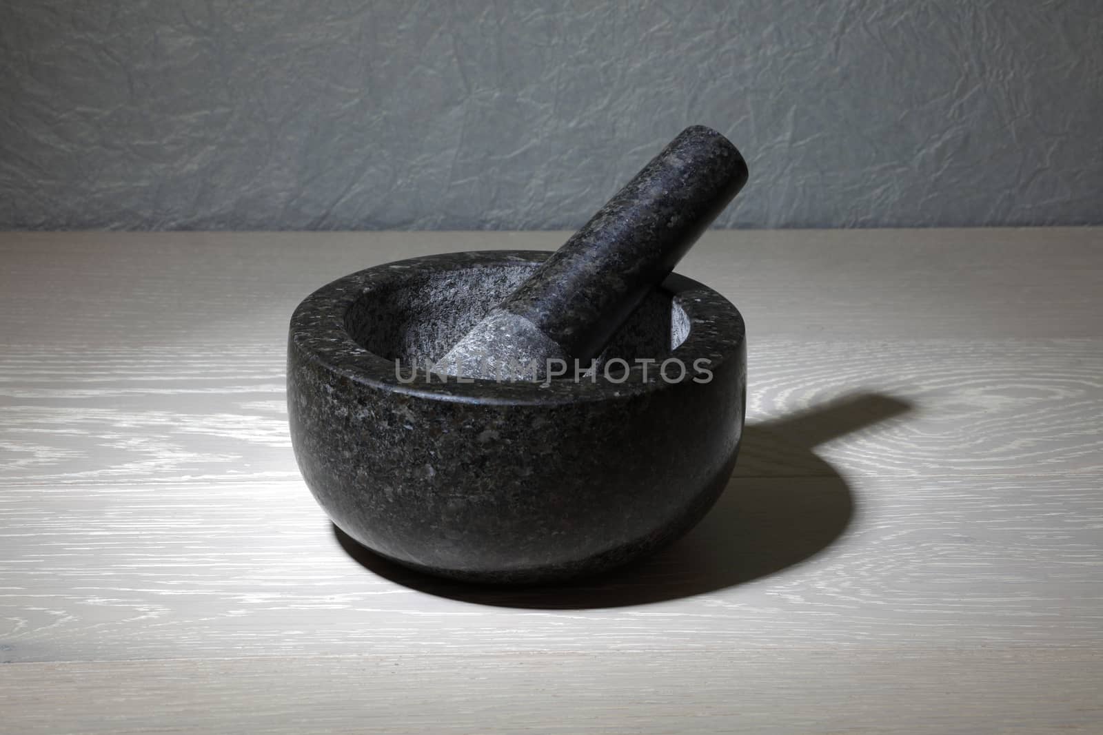A mortar and pestle on kitchen work surface