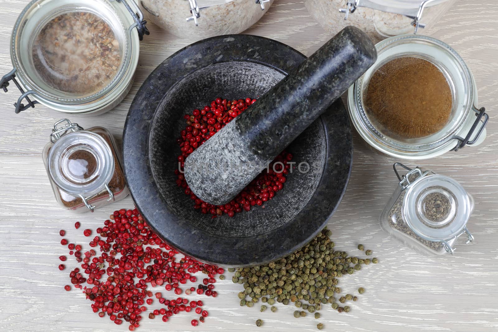 pepper corns and mortar and pestle grinder from top