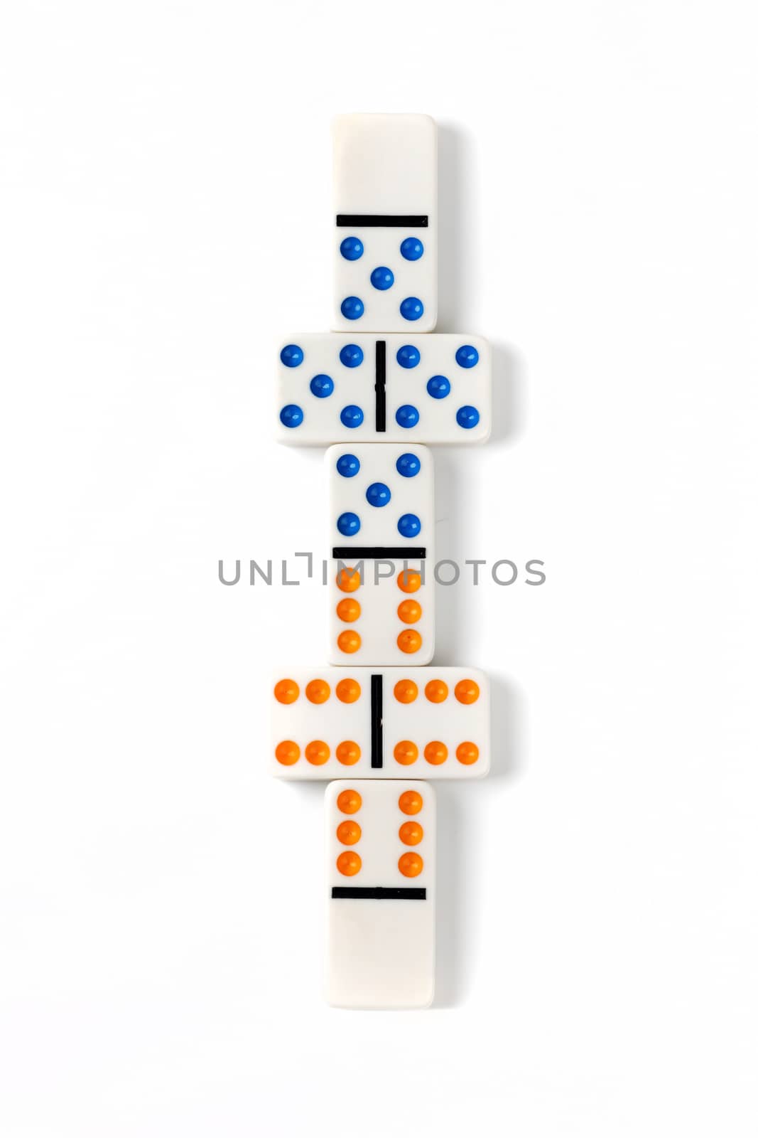 Some colorful dominoes arranged on a white surface