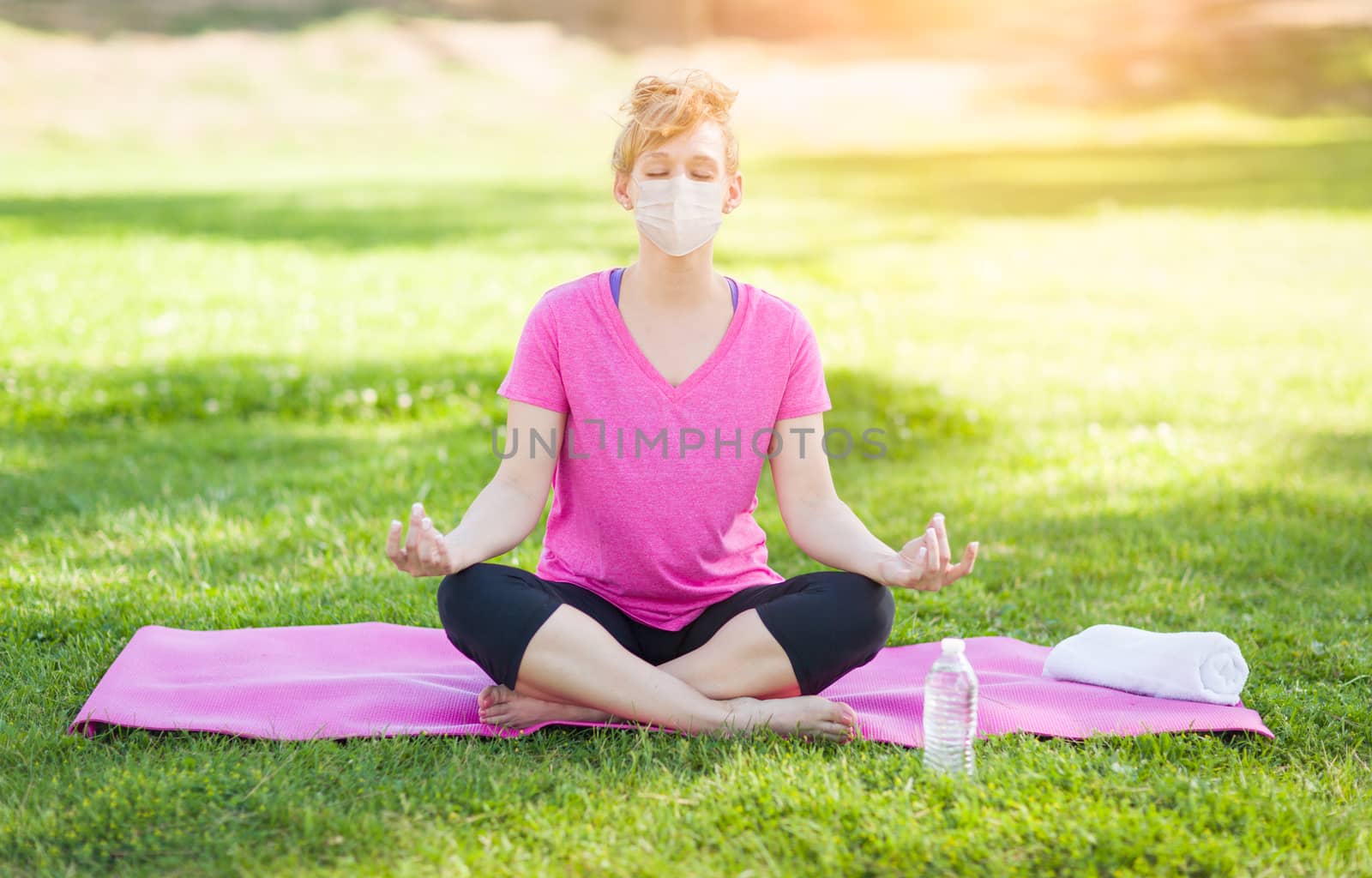 Girl Wearing Medical Face Mask During Yoga Meditation Workout Outdoors.