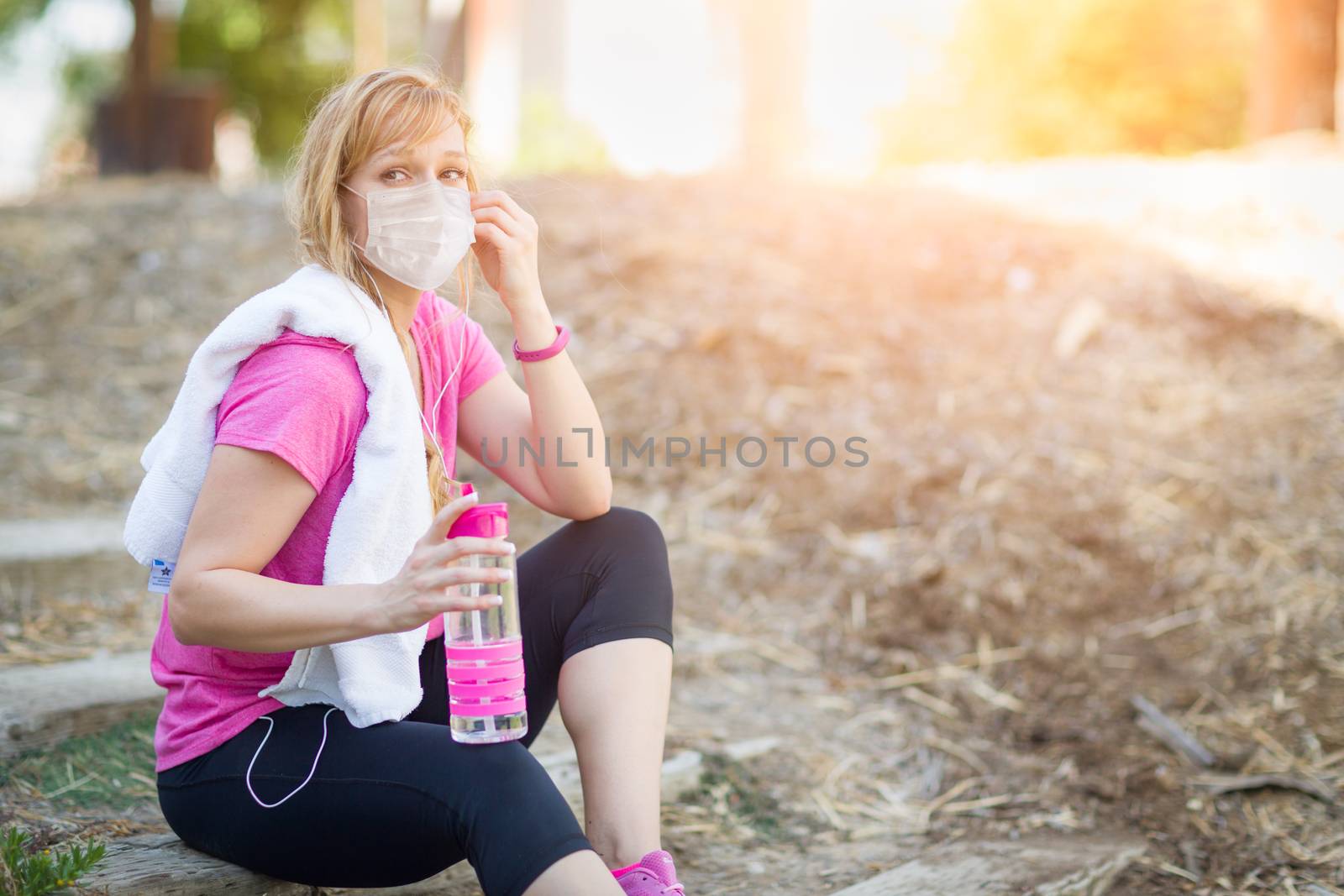 Girl Wearing Medical Face Mask During Workout Outdoors.