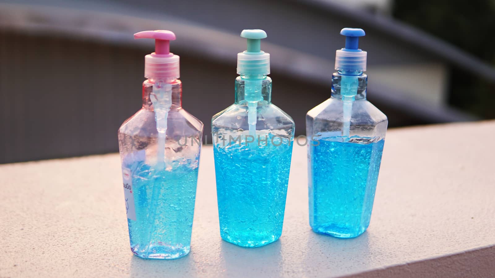 Dispenser bottles of alcohol based gel hand sanitizers to keep hands from germs and bacteria during the Covid-19 or Coronavirus pandemic.