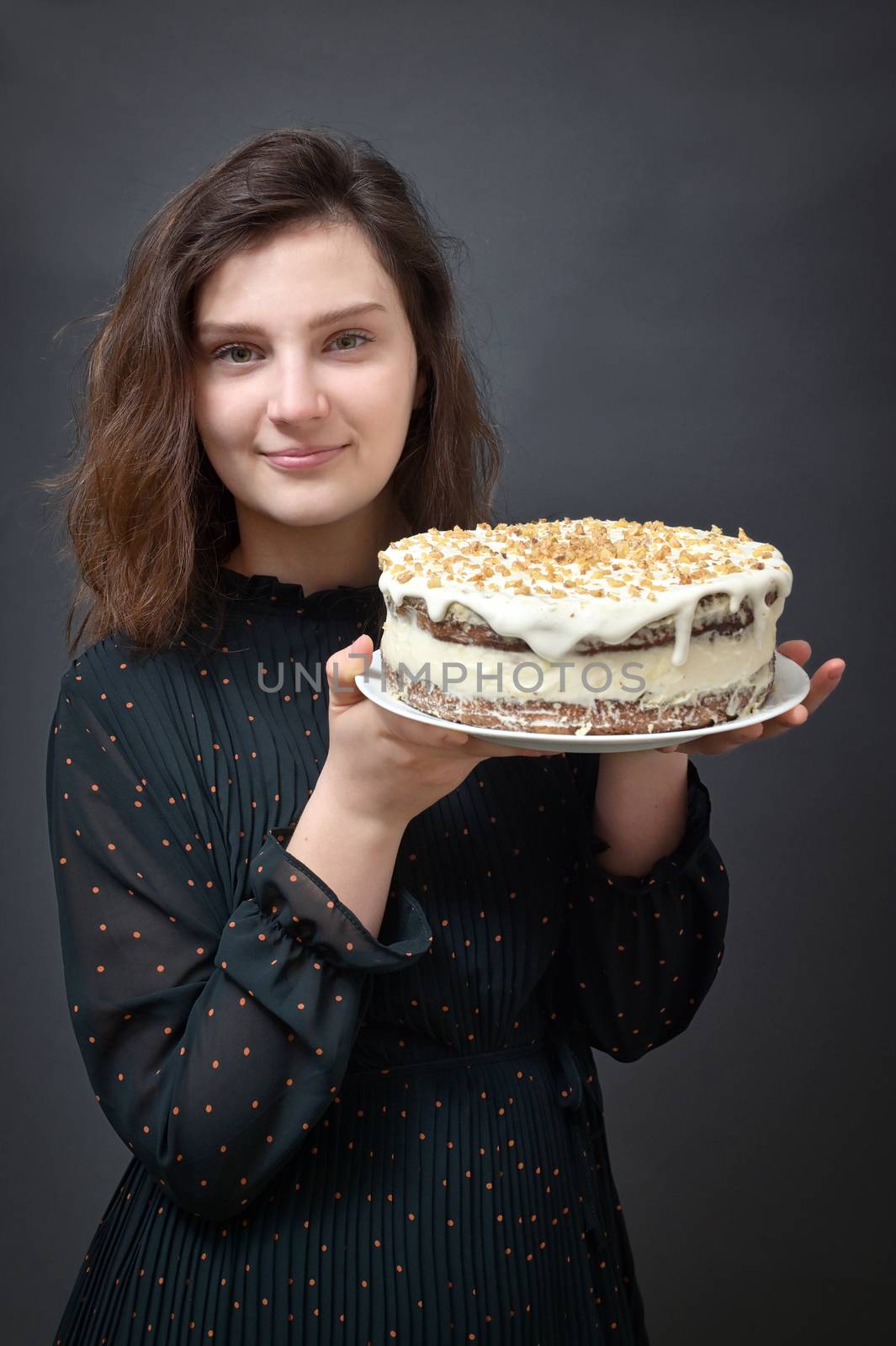 Young Girl Holding Birthday Cake in Studio