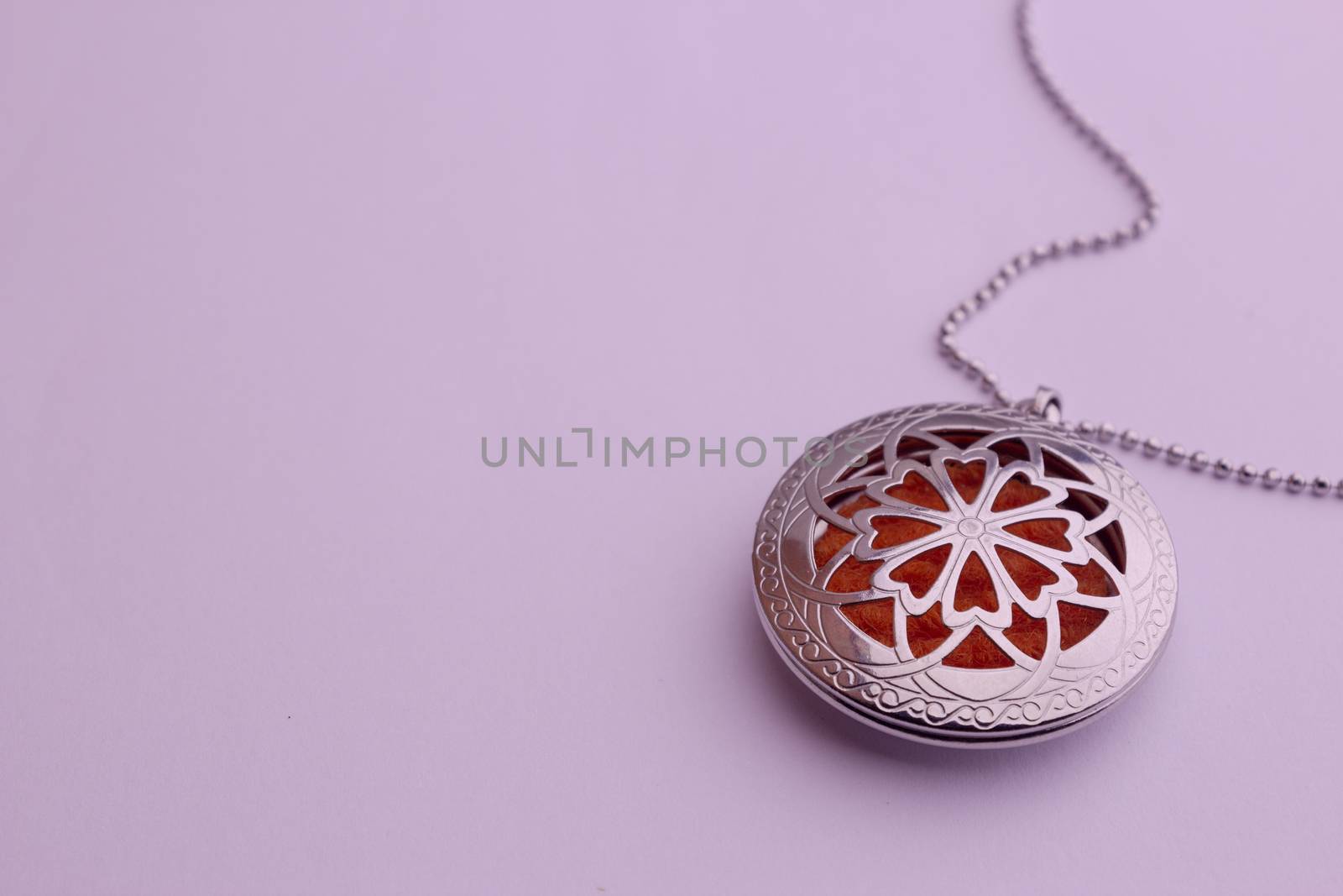 Essential oil infuser used as pendant of a necklace